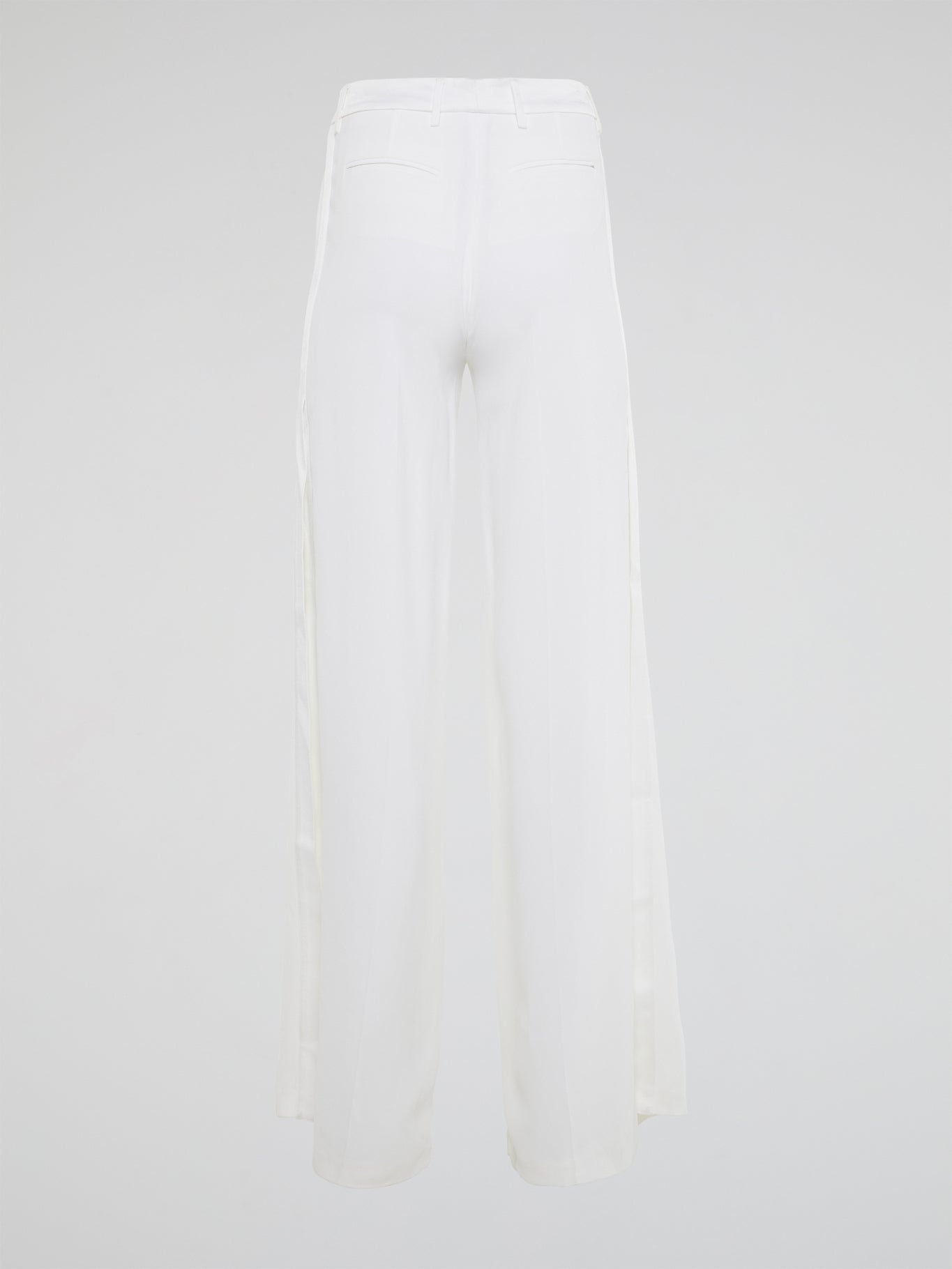 Elevate your style with these stunning white palazzo pants from Roberto Cavalli, designed to make you stand out from the crowd. The luxurious fabric drapes elegantly as you move, creating a sophisticated silhouette that is both comfortable and chic. Perfect for a day at the beach or a night on the town, these palazzo pants are a must-have addition to your wardrobe.