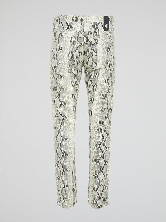 Infuse your wardrobe with a touch of wild sophistication with these snake print skinny trousers from Roberto Cavalli. Crafted from luxurious fabric, these statement pants will elevate any outfit from basic to bold in an instant. Step out in style and turn heads wherever you go with these modern, edgy trousers that exude confidence and glamour.