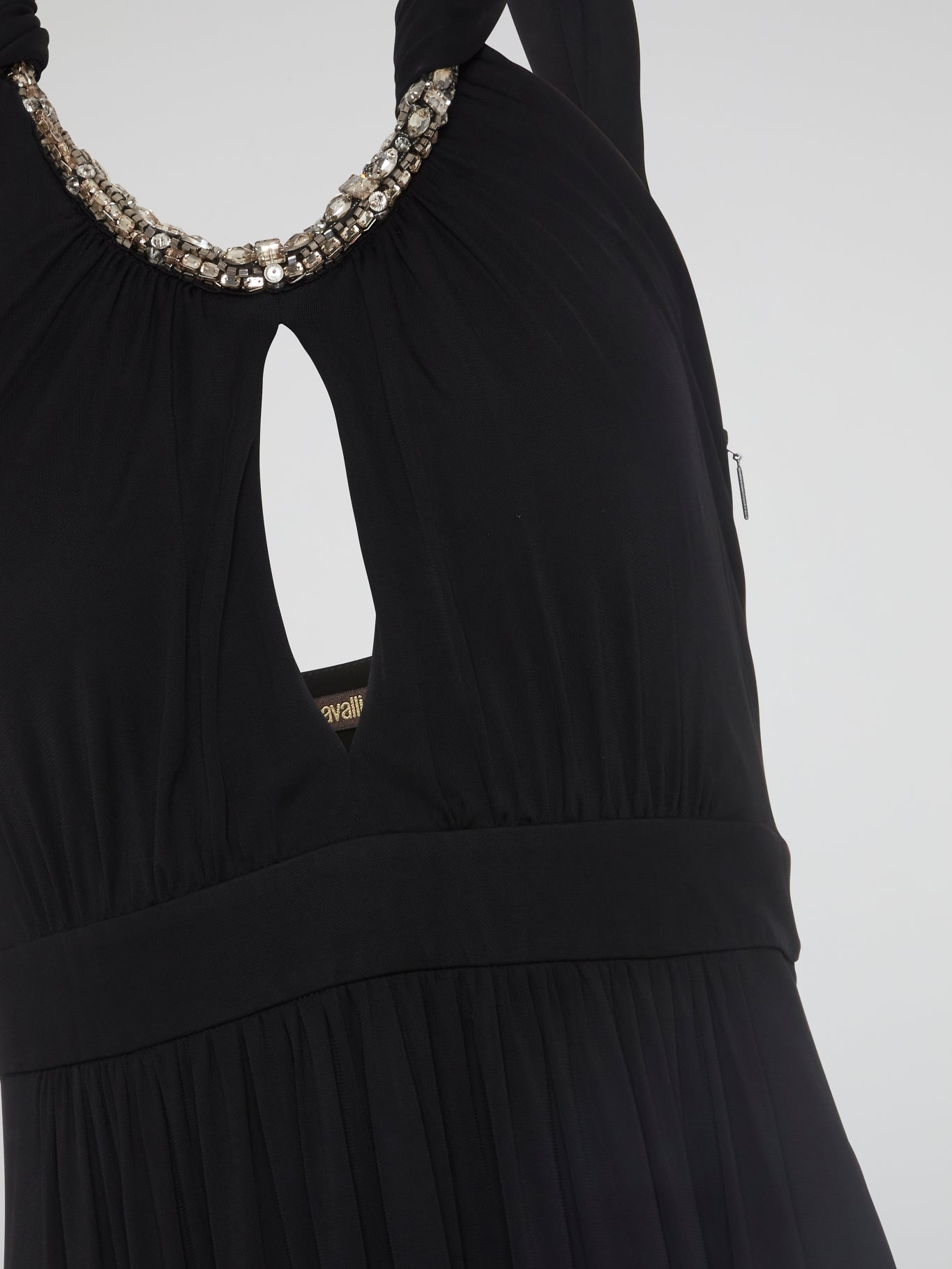 Elegance meets edgy in this show-stopping Black Crystal Embellished Halter Neck Maxi Dress by Roberto Cavalli. Adorned with shimmering crystals that catch the light with every step, this dress is sure to turn heads at any event. Whether you're hitting the red carpet or dancing the night away, this dress will make you feel like a true fashion icon.