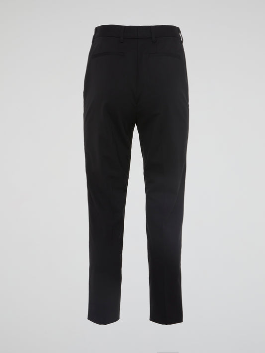 Elevate your wardrobe with these sleek and sophisticated black tapered pants from Roberto Cavalli. Crafted with the finest materials, these pants are designed to hug your curves in all the right places. Stand out from the crowd and make a style statement with these effortlessly chic trousers.