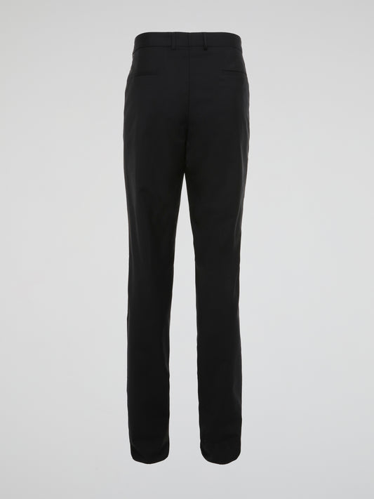 Elevate your wardrobe with these sleek and sophisticated Black High Waist Suit Pants by Roberto Cavalli. Crafted with meticulous attention to detail, these pants feature a flattering high waist design that elongates your silhouette. Whether styled with a crisp white shirt for the office or a statement blouse for a night out, these pants are sure to turn heads wherever you go.