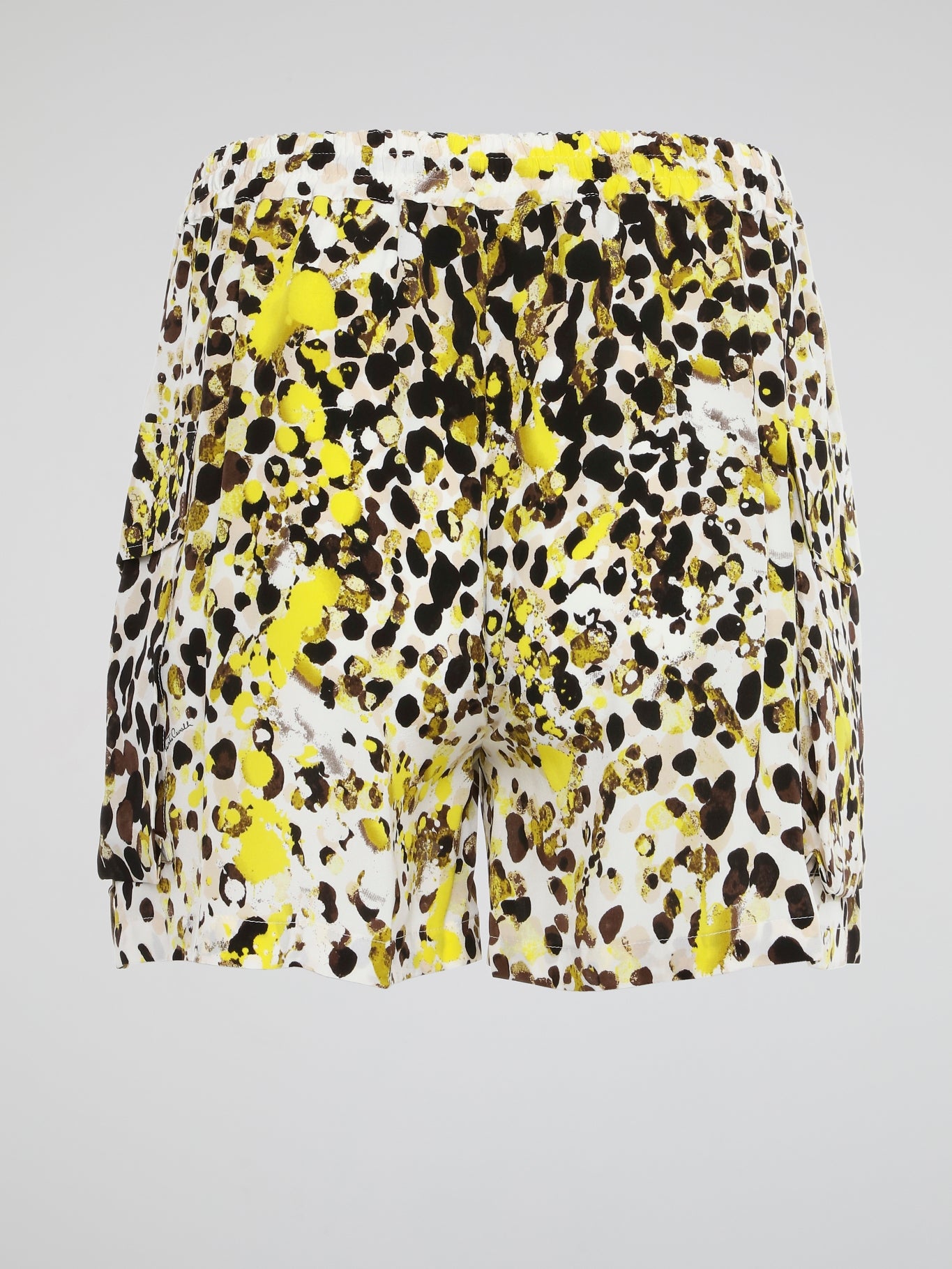 Elevate your summer style with these unique Paint Splatter Drawstring Cargo Shorts from Roberto Cavalli. Hand-painted splatters of color add an artistic flair to these classic cargo shorts, making them a standout piece in your wardrobe. Whether you're hitting the beach or exploring the city, these shorts are sure to turn heads and keep you comfortable all day long.