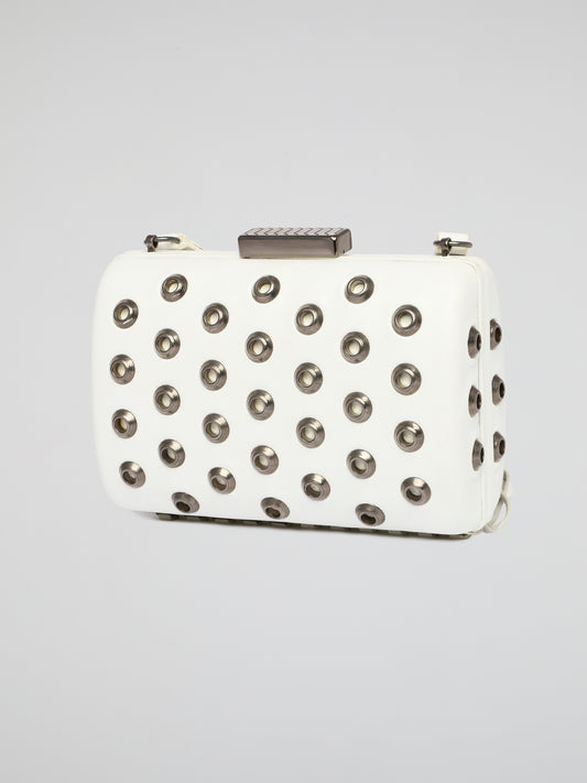 Elevate your accessory game with this stunning white embellished leather clutch by Roberto Cavalli. The intricate detailing and luxurious material make it a standout piece for any special occasion or night out. Make a bold statement and turn heads wherever you go with this elegant and chic clutch in hand.
