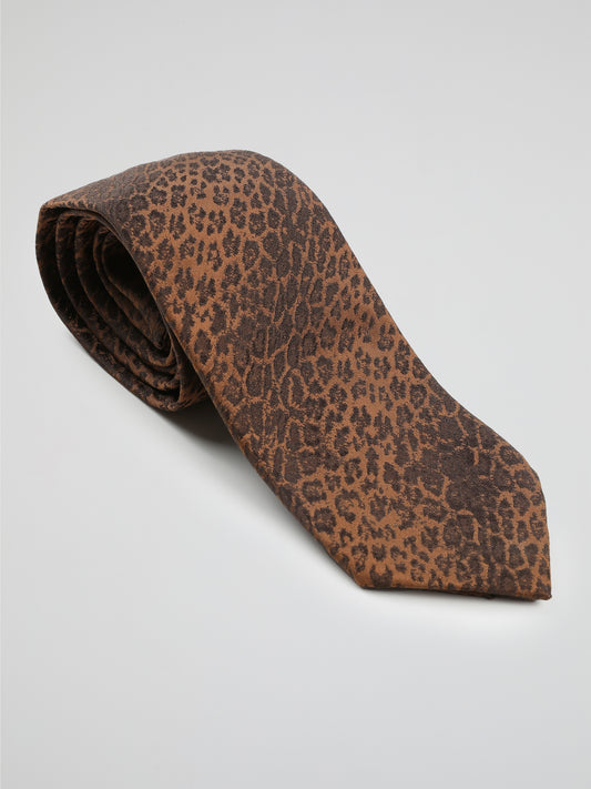 Introducing the Orange Animal Print Neck Tie by Roberto Cavalli, where fierce fashion meets untamed elegance. Crafted from luxurious silk, this eye-catching accessory features an intricate animal print in vibrant orange hues, making it a truly distinctive addition to your wardrobe. Whether you're heading to a formal event or want to add a wild touch to your everyday style, this neck tie will undoubtedly make you the king of the concrete jungle.