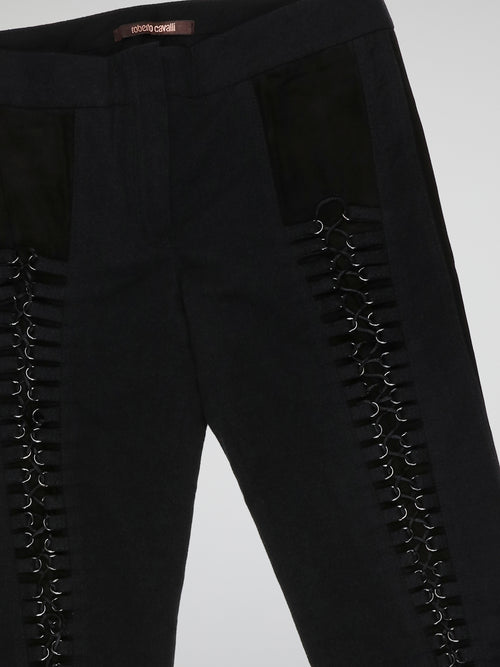 Step into elegance with these stunning Black Embellished Trousers by Roberto Cavalli. Crafted with meticulous care, each detail on these trousers tells a story of sophistication and luxury. From the delicate beaded embellishments to the figure-flattering silhouette, these trousers are a fashion statement that exudes confidence and style.