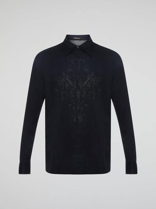 Step into the realm of effortless elegance with the captivating Black Embroidered Shirt by Roberto Cavalli. Adorned with intricate embroidery and delicate lace details, this shirt is a mesmerizing fusion of sophistication and sensuality. Elevate your style with this statement piece that exudes an air of mystique and timeless allure.