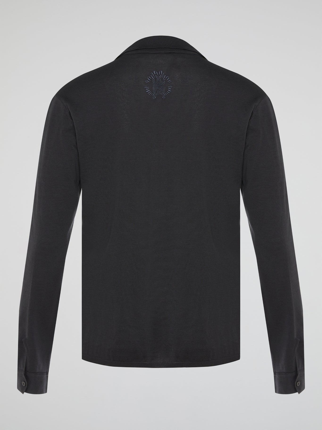Elevate your style with the timeless elegance of our Black Long Sleeve Polo Shirt by Roberto Cavalli. Crafted with meticulous attention to detail, this wardrobe staple features a luxurious blend of comfort and sophistication. Whether you're headed to a casual brunch or a formal event, this Polo Shirt will effortlessly take you from day to night with its sleek design and iconic Cavalli logo.