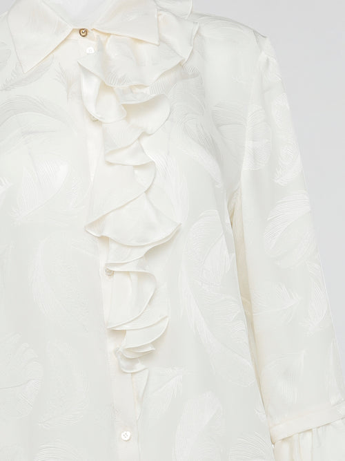 Embrace the essence of high-end fashion with the Ruffle Detailed Shirt by Roberto Cavalli. This stunning piece perfectly combines elegance and playfulness with its intricate ruffles that gracefully dance along the collar and cuffs. Crafted from luxurious materials, this shirt is a true statement piece that effortlessly elevates any outfit.