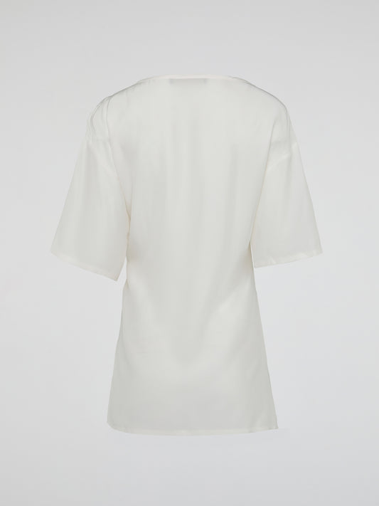 Elevate your wardrobe with the timeless elegance of the White Ruched Top by Roberto Cavalli. Crafted from luxurious fabric, this top features a flattering ruched design that accentuates your curves while adding a touch of sophistication to any outfit. Whether you're attending a glamorous event or a casual day out, this piece effortlessly exudes confidence and style, making it a must-have addition to your collection.