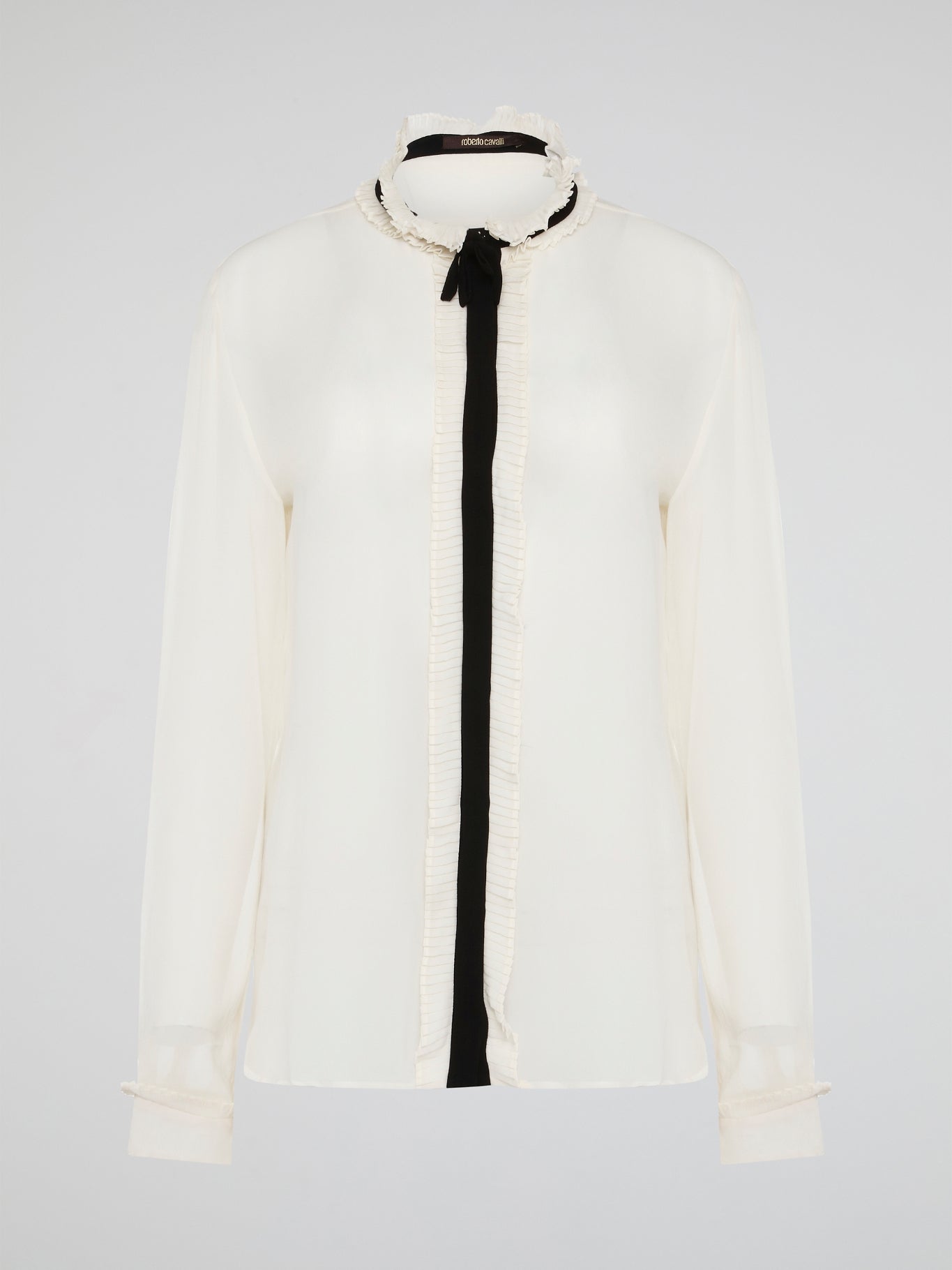 Step into luxury and sophistication with the Roberto Cavalli White Frill Detailed Blouse. The delicate frill detailing adds a touch of elegance to this classic white blouse, making it a perfect choice for any special occasion. Elevate your wardrobe with this timeless piece that exudes high-end fashion and style.