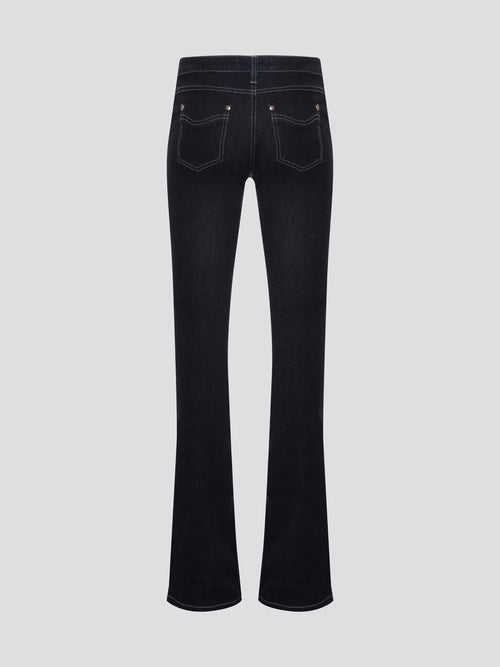 Step out in style with these Roberto Cavalli Black Contrast Stitch Flared Jeans, a modern twist on a classic silhouette. The contrast stitching adds a touch of edge to these sleek black jeans, making them a wardrobe staple for any fashion-forward individual. Pair them with a simple white t-shirt and heels for a chic and sophisticated look that will turn heads wherever you go.