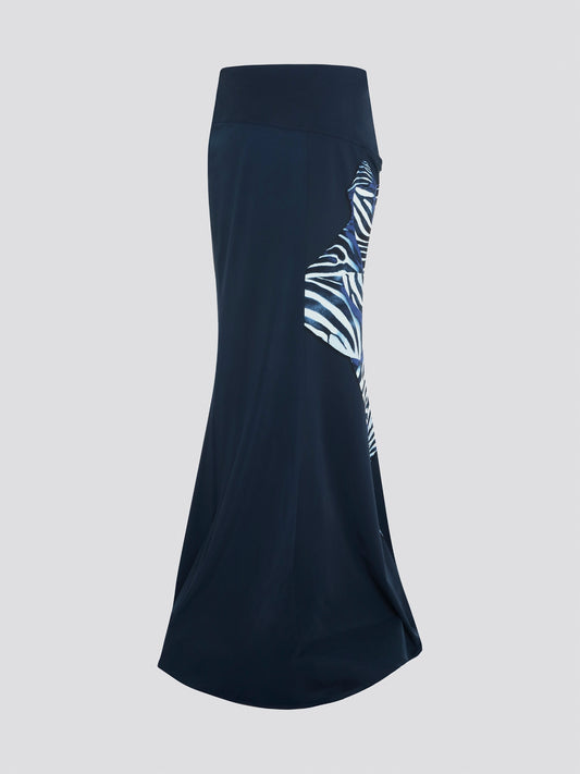 Step into the spotlight with the stunning Navy Foliage Maxi Skirt by Roberto Cavalli. The intricate foliage print cascades down the lush navy fabric, creating a luxurious and elegant look. Perfect for a night out or a special event, this skirt is sure to make a statement wherever you go.