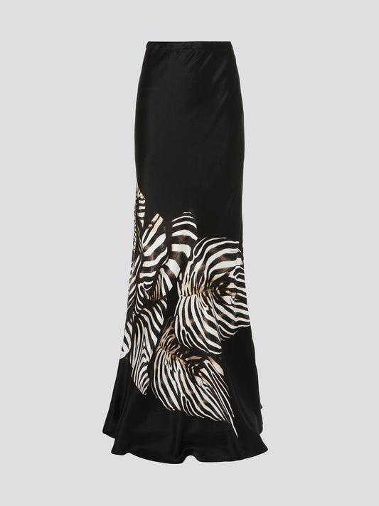 Feel like a true fashion icon in this exquisite Black Foliage Flared Maxi Skirt by Roberto Cavalli. The intricate foliage pattern adds a touch of mysterious allure to the flowing silhouette, making it perfect for any special occasion or night out. Turn heads and make a statement wherever you go in this stunning and unique piece.