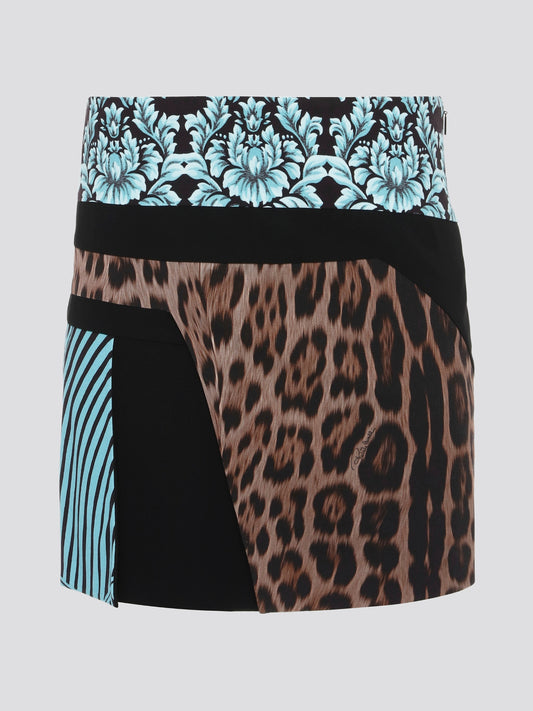 Unleash your wild side with the Roberto Cavalli Leopard Print Panel Mini Skirt. This fierce and fabulous skirt features a bold leopard print design that is sure to turn heads wherever you go. With its figure-flattering silhouette and eye-catching details, this skirt is a must-have for any fashion lover looking to make a statement. Add a touch of exotic glamour to your wardrobe with this statement piece from Roberto Cavalli.