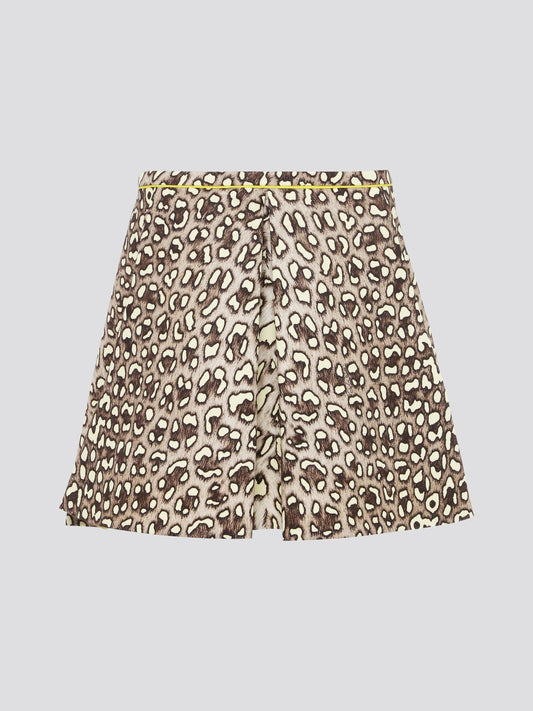 Unleash your wild side with the Leopard Print Box Pleat Mini Skirt from Roberto Cavalli. This fierce and flirty skirt features a bold leopard print pattern that is sure to turn heads wherever you go. With its flattering box pleats and mini length, this skirt is perfect for a night out on the town or a stylish day at the office.