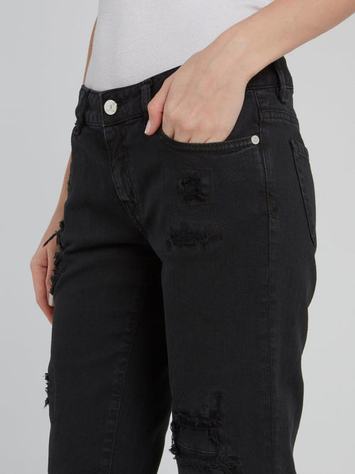 Черные джинсы с рваной отделкой