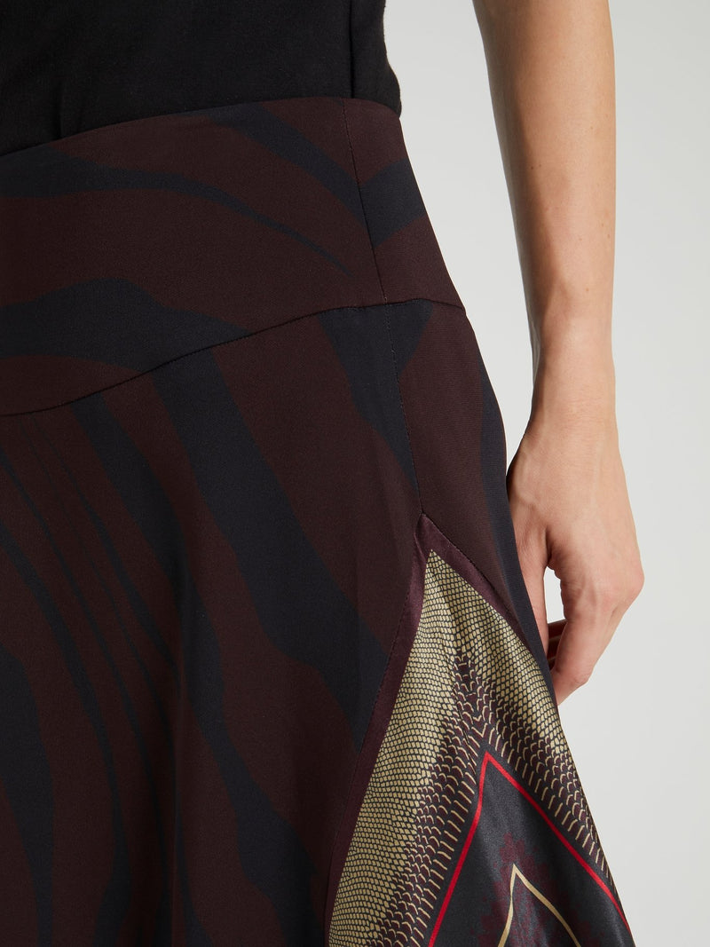 Асимметричная юбка-миди с анималистическим принтом